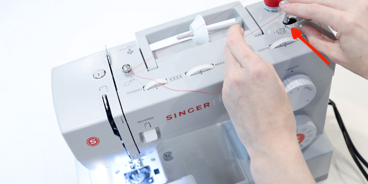 engaging the bobbin winding function on the top of a singer heavy duty sewing machine