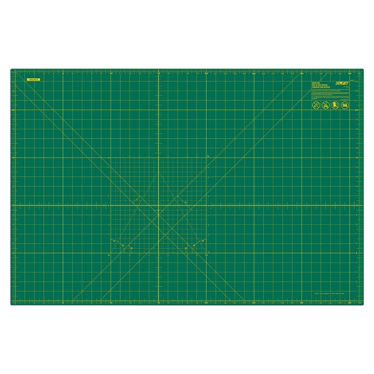 a green cutting mat with yellow grid cutting lines for sewing